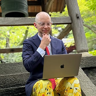 Nick in pajamas working